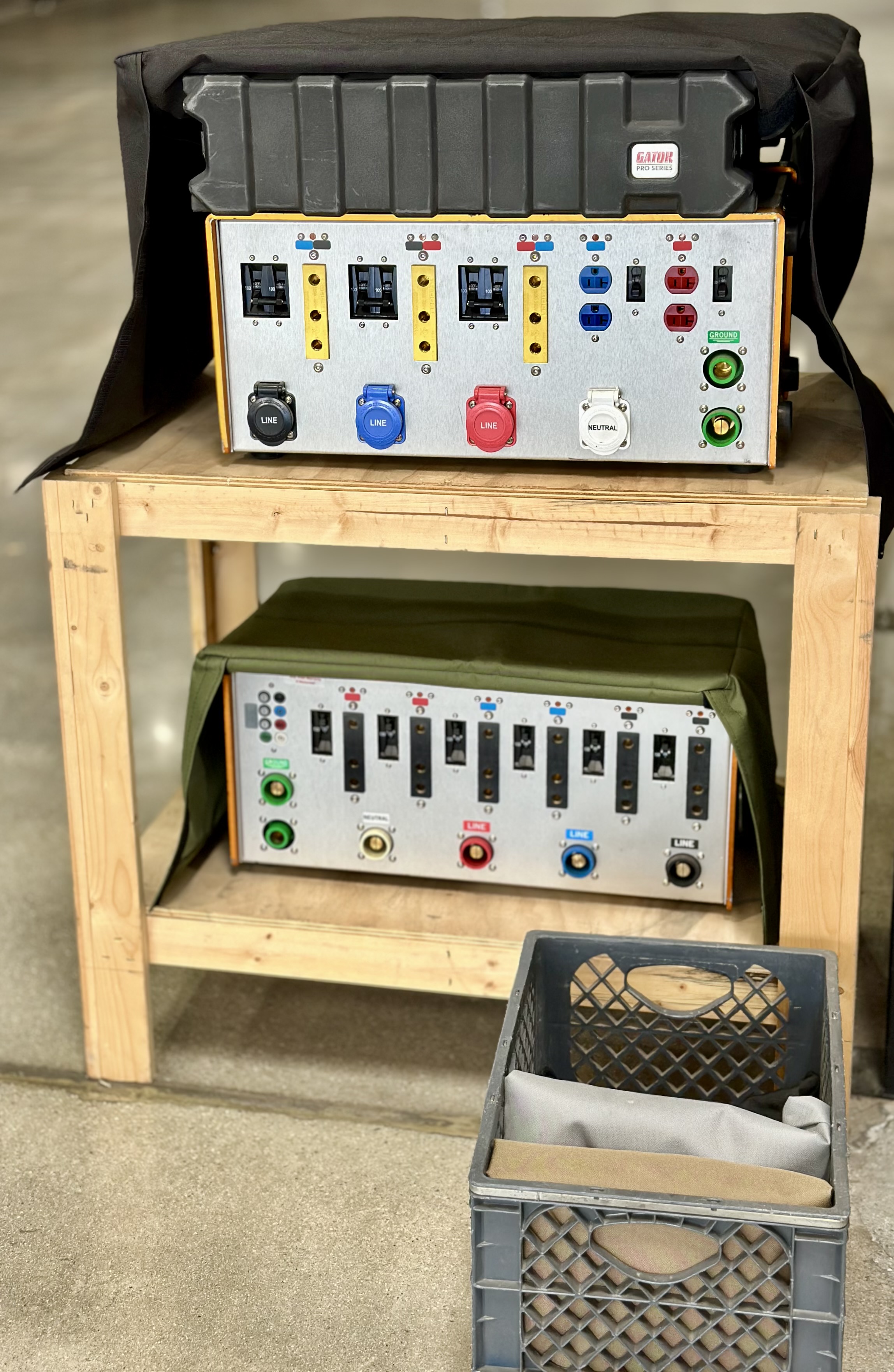 Large and small Cover-Alls on display, and folded up nicely for storing in a milk crate.